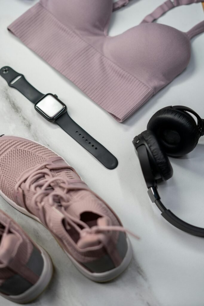 pexels photo 3927389 3927389 Flat lay of gym essentials with pink sportswear and smartwatch.
